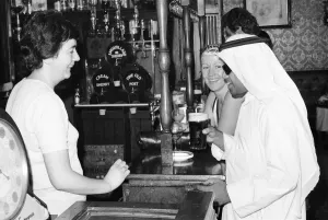 Arab man enjoying a pint of Guinness at the Stanhope public house on Gloucester Road Arab man enjoying a pint of Guinness at the Stanhope public house on Gloucester Road
