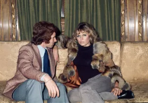 Arsenal footballer Alan Ball sitting on a sofa talking to actress June Ege during a team Arsenal footballer Alan Ball sitting on a sofa talking to actress June Ege during a team