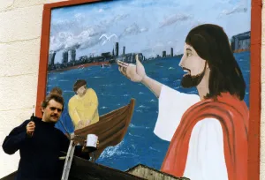 Art student Gary McNamara with the mural he has painted above the entrance to St Pius Art student Gary McNamara with the mural he has painted above the entrance to St Pius