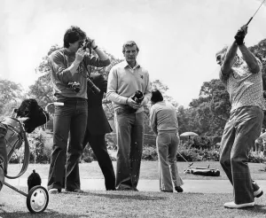 Aston Villa footballer Dennis Mortimer takes a photograph of manager Ron Saunders Aston Villa footballer Dennis Mortimer takes a photograph of manager Ron Saunders
