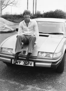 Aston Villa midfielder Gordon Cowans sits proudly on the bonnet of his new 6 Aston Villa midfielder Gordon Cowans sits proudly on the bonnet of his new 6