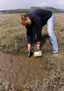 Atoms Geiger Counter measuring radioactivity in soil around Sellafield Atoms Geiger Counter measuring radioactivity in soil around Sellafield