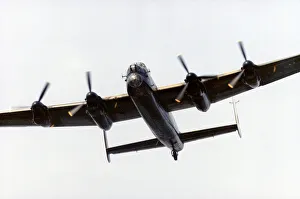 An Avro Lancaster bomber in flight over Littleton Road playing fields, Manchester An Avro Lancaster bomber in flight over Littleton Road playing fields, Manchester