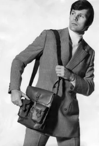 Bag That man. Now a man can go anywhere with nothing in his pockets Bag That man. Now a man can go anywhere with nothing in his pockets
