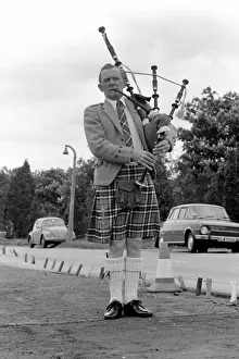 Bagpipes: Lone piper Jim Thomas. May 1975 75-2512-004 Bagpipes: Lone piper Jim Thomas. May 1975 75-2512-004