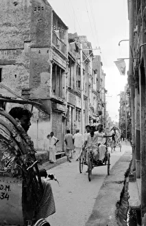 Bangladesh - Street Scene Tikka Khan Street with Pakistan flags hanging from Bangladesh - Street Scene Tikka Khan Street with Pakistan flags hanging from