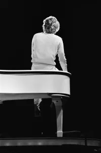 Barry Manilow, pictured from behind sitting on a piano, during rehearsals for his Barry Manilow, pictured from behind sitting on a piano, during rehearsals for his