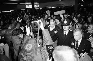 Barry Manilow surrounded by his many fans as he leaves Heathrow Airport. 7th January 1982 Barry Manilow surrounded by his many fans as he leaves Heathrow Airport. 7th January 1982