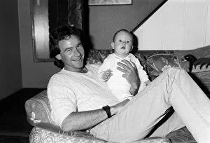 Barry Sheene at home with baby daughter Sidonie, May 1985 Barry Sheene at home with baby daughter Sidonie, May 1985