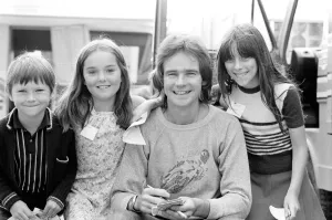 Barry Sheene signs autographs for three young children who broke through the security to Barry Sheene signs autographs for three young children who broke through the security to
