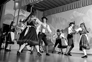 Bavarian couples in traditional dress dancing on stage during a night out in Ruhpolding Bavarian couples in traditional dress dancing on stage during a night out in Ruhpolding