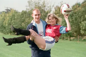 BBC Radio WM presenter Julie Mayer in an Aston Villa kit with Villa midfielder Mark BBC Radio WM presenter Julie Mayer in an Aston Villa kit with Villa midfielder Mark