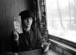 The Beatles February 1964 Ringo Starr holding Seaboard railroad card on the train The Beatles February 1964 Ringo Starr holding Seaboard railroad card on the train