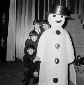 The Beatles at Finsbury Park Astoria, posing next to a snowman The Beatles at Finsbury Park Astoria, posing next to a snowman