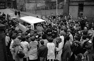 The Beatles leave Birmingham in a van surrounded by hundreds of screaming fans The Beatles leave Birmingham in a van surrounded by hundreds of screaming fans