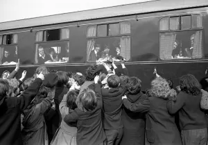 The Beatles March 1964 Crowds of school children wave to the Beatles sitting on a The Beatles March 1964 Crowds of school children wave to the Beatles sitting on a
