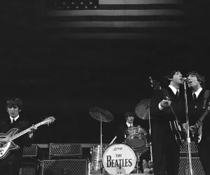 The Beatles onstage before the stars and stripes on the second night of their US tour at The Beatles onstage before the stars and stripes on the second night of their US tour at