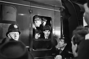 The Beatles peer from a train carriage window at Paddington Station, London The Beatles peer from a train carriage window at Paddington Station, London