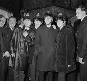 The Beatles pop group pose with a group of policemen in Birmingham The Beatles pop group pose with a group of policemen in Birmingham