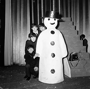 The Beatles pose with a Snowman, as they take a break from rehearsals at the Astoria The Beatles pose with a Snowman, as they take a break from rehearsals at the Astoria