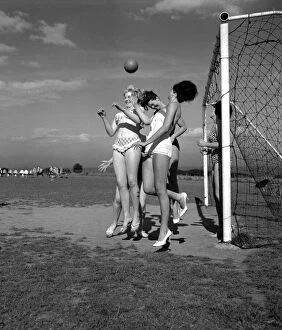 00236 Collection: Beauty contest girls playing football at Filey. 30th August 1960
