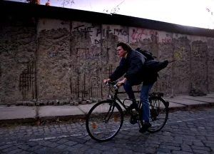 Berlin ten years after the wall a man is seen cycling by Berlin ten years after the wall a man is seen cycling by