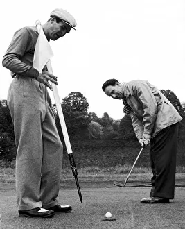 Birmingham Mail film critic Arthur Steele plays golf with Stanley Baker in Richmond Birmingham Mail film critic Arthur Steele plays golf with Stanley Baker in Richmond
