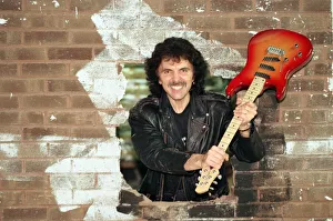 Black Sabbath's Tony Iommi helps to demolish a wall at Musical Exchanges in Black Sabbath's Tony Iommi helps to demolish a wall at Musical Exchanges in