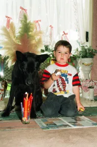Blackie the dog is pictured with a small boy. 17th June 1993 Blackie the dog is pictured with a small boy. 17th June 1993