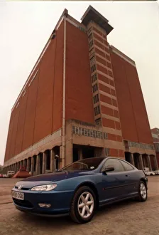 BLUE PEUGEOT 406 COUPE CAR AUGUST 1997 IN FRONT OF BUILDING BLUE PEUGEOT 406 COUPE CAR AUGUST 1997 IN FRONT OF BUILDING
