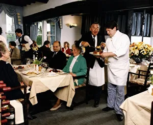 Bob Monkhouse Comedian TV Presenter and Entertainer trying his hand as a waiter at Bob Monkhouse Comedian TV Presenter and Entertainer trying his hand as a waiter at