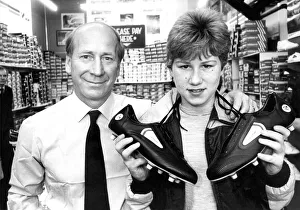 Bobby Charlton with budding soccer star paul Barrett when he chose a pair of football Bobby Charlton with budding soccer star paul Barrett when he chose a pair of football
