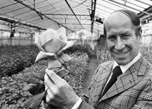 Bobby Charlton holding a rose in a greenhouse. 3rd January 1988 Bobby Charlton holding a rose in a greenhouse. 3rd January 1988