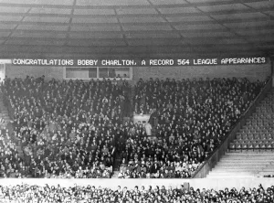 Bobby Charlton has his name in lights on the new electronic scoreboard at Old Trafford Bobby Charlton has his name in lights on the new electronic scoreboard at Old Trafford