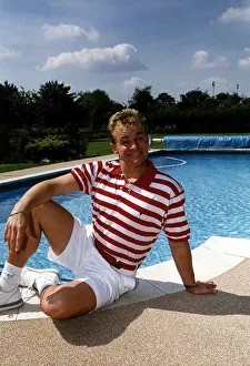 Bobby Davro Comic TV Presenter Sitting beside pool Bobby Davro Comic TV Presenter Sitting beside pool