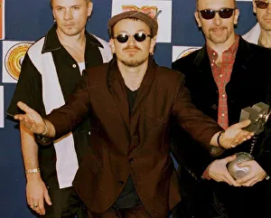 Bono, lead singer of Irish rock group U2, looks bemused after his band received the Best Bono, lead singer of Irish rock group U2, looks bemused after his band received the Best