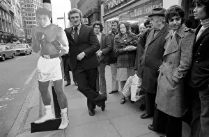 Boxer Joe Bugner waiting at a bus stop with a life size cut out of Mohammad Ali on his Boxer Joe Bugner waiting at a bus stop with a life size cut out of Mohammad Ali on his