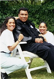 Boxer Muhammad Ali (Cassius Clay) with daughters . August 1992 Boxer Muhammad Ali (Cassius Clay) with daughters . August 1992