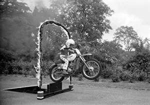 Boy Stunt Rider: 6 year old Darius Goodwin is pictured here leaping through flames for Boy Stunt Rider: 6 year old Darius Goodwin is pictured here leaping through flames for