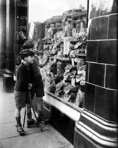 Boys visit a local sweet shop as the end of sweet rationing is enforced. 22nd April 1949 Boys visit a local sweet shop as the end of sweet rationing is enforced. 22nd April 1949