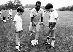 Brazilian football star Pele ashowing off his skills to American youngsters at his soccer Brazilian football star Pele ashowing off his skills to American youngsters at his soccer