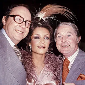 British comedy duo Ernie Wise and Eric Morecambe pose with Kate O'Mara British comedy duo Ernie Wise and Eric Morecambe pose with Kate O'Mara