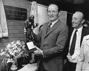 Former British Heavyweight champion boxer Henry Cooper holds a bronze statue of himself Former British Heavyweight champion boxer Henry Cooper holds a bronze statue of himself