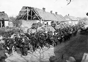 British troops passing tanks in a French village close to Amiens following the German British troops passing tanks in a French village close to Amiens following the German
