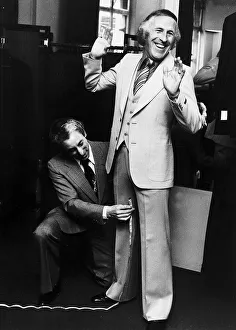 Bruce Forsyth Entertainer being measured up for a new suit Bruce Forsyth Entertainer being measured up for a new suit