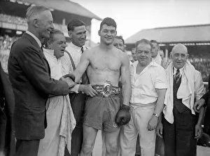 Bruce Woodcock Boxer / Boxing Wearing championship belt in ring with his Bruce Woodcock Boxer / Boxing Wearing championship belt in ring with his
