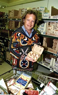 Bruno Brookes Disc jockey and TV Presenter holding open a carton of eggs while doing Bruno Brookes Disc jockey and TV Presenter holding open a carton of eggs while doing