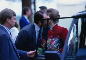 Captain Mark Phillips June 1988 giving Princess Anne a kiss on cheek at car door Captain Mark Phillips June 1988 giving Princess Anne a kiss on cheek at car door