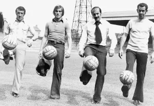 Celtic FC team players Danny McGrain Kenny Dalglish (L) Harry Hood Tom Callaghan kicking Celtic FC team players Danny McGrain Kenny Dalglish (L) Harry Hood Tom Callaghan kicking