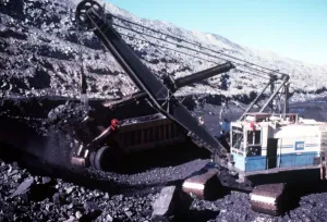Nine centimetre bucket filling 110 tonne haul unit with black coal at Ravensworth mine Nine centimetre bucket filling 110 tonne haul unit with black coal at Ravensworth mine
